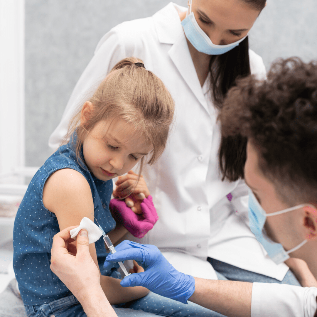Young girl receives vaccine shot for COVID-19 virus